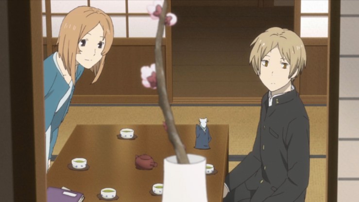 Yaki, Natsume, and a small youkai admire the branch another youkai left for Yaki in episode 5 of Natsume Yuujinchou Go.
