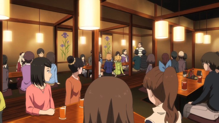 The director in Shirobako celebrates with his team.
