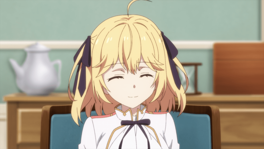 A picture of Anis looking beyond the camera and forcing herself to smile.